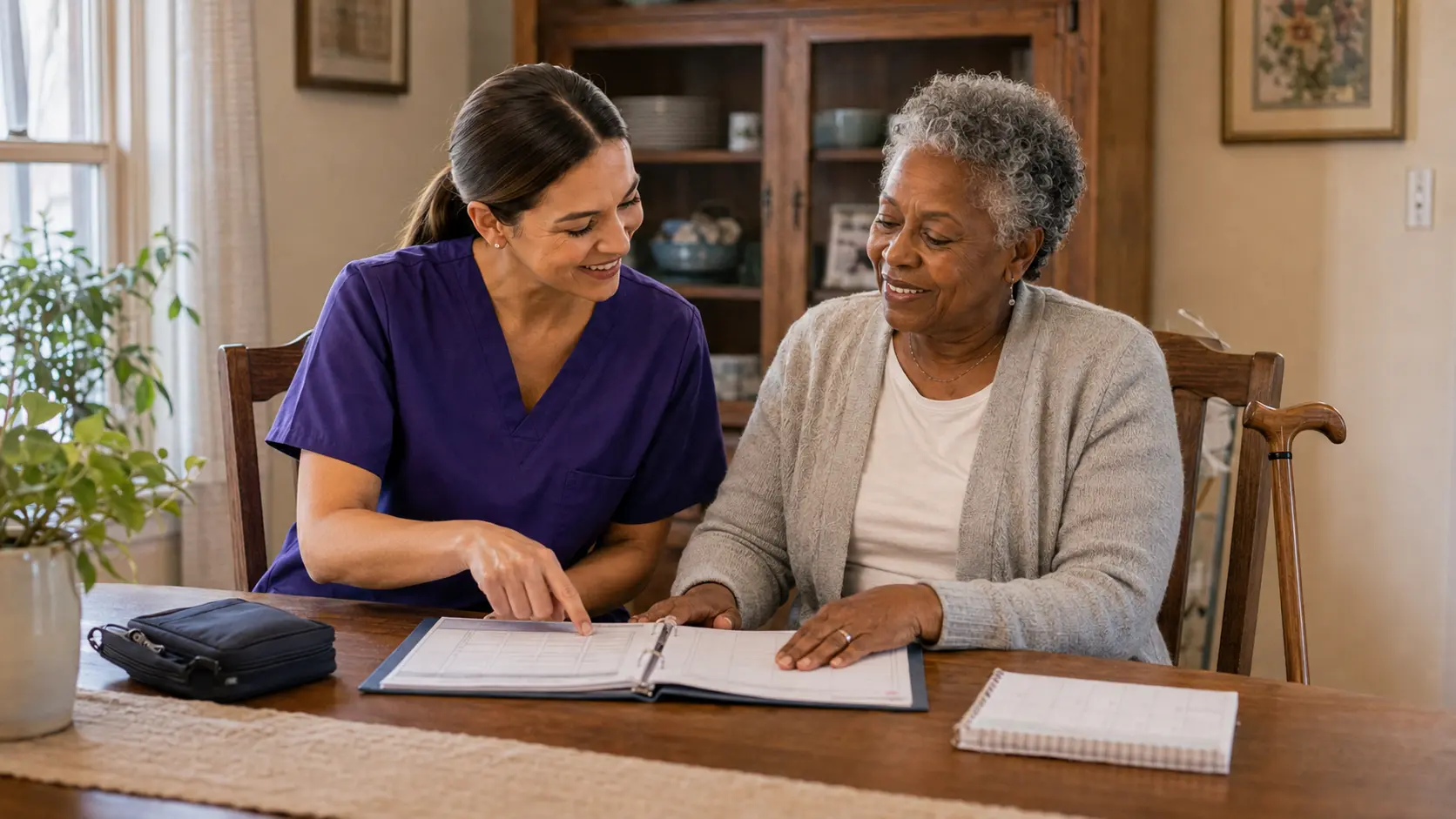 A caregiver and an older adult reviewing a care plan together at home